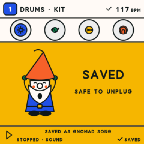The FM-1 screen after saving: the Gnome beside the words Saved, safe to unplug.